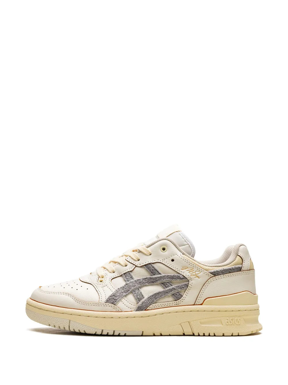 White leather low-top sneakers with gray side stripes, tan accents, lace-up