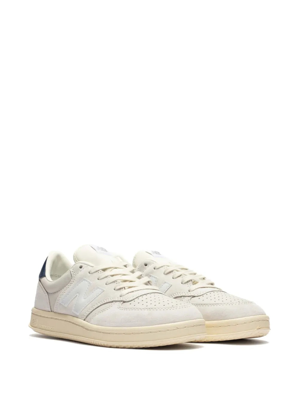 Off-white lace-up sneakers, side profile with New Balance branding and gum outsole