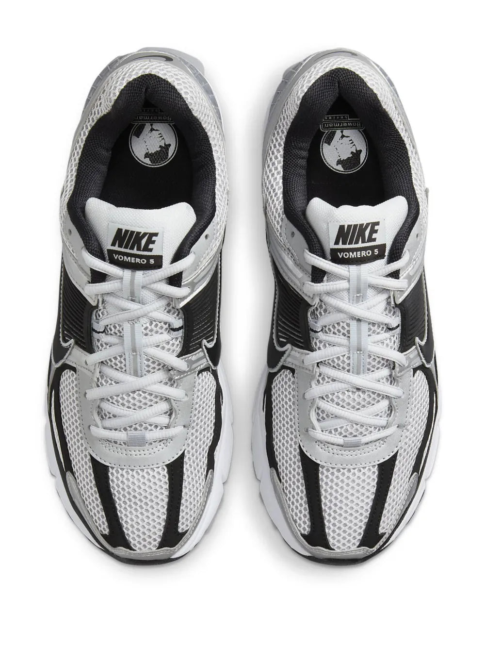 Nike Zoom Vomero 5 lace-up sneakers with black heel and white laces, top view pair