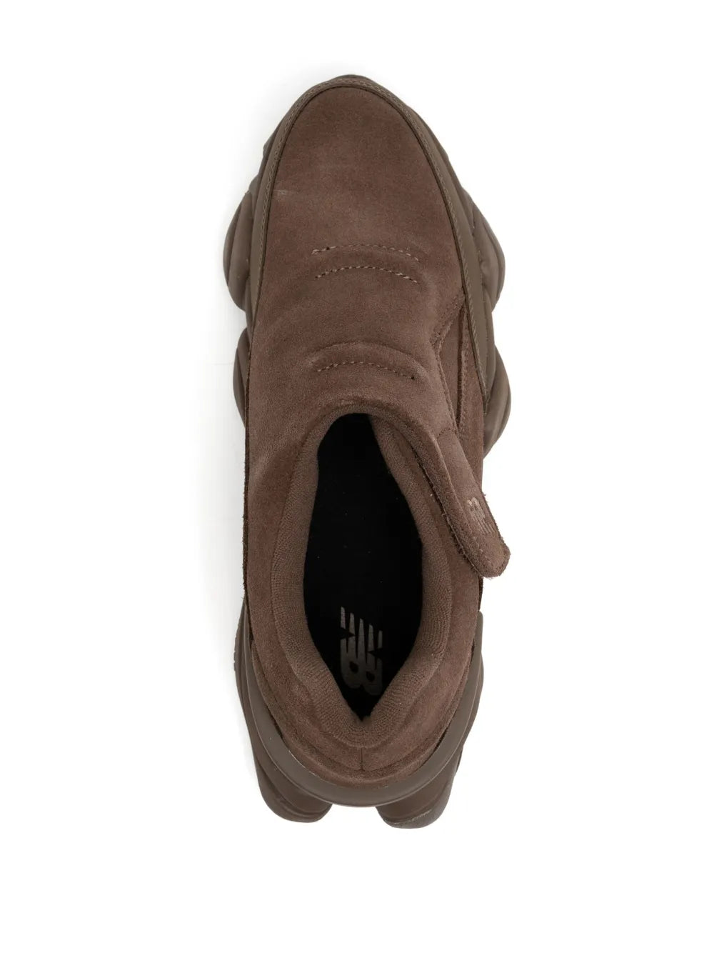 Brown sneaker with suede upper and visible interior lining, side profile