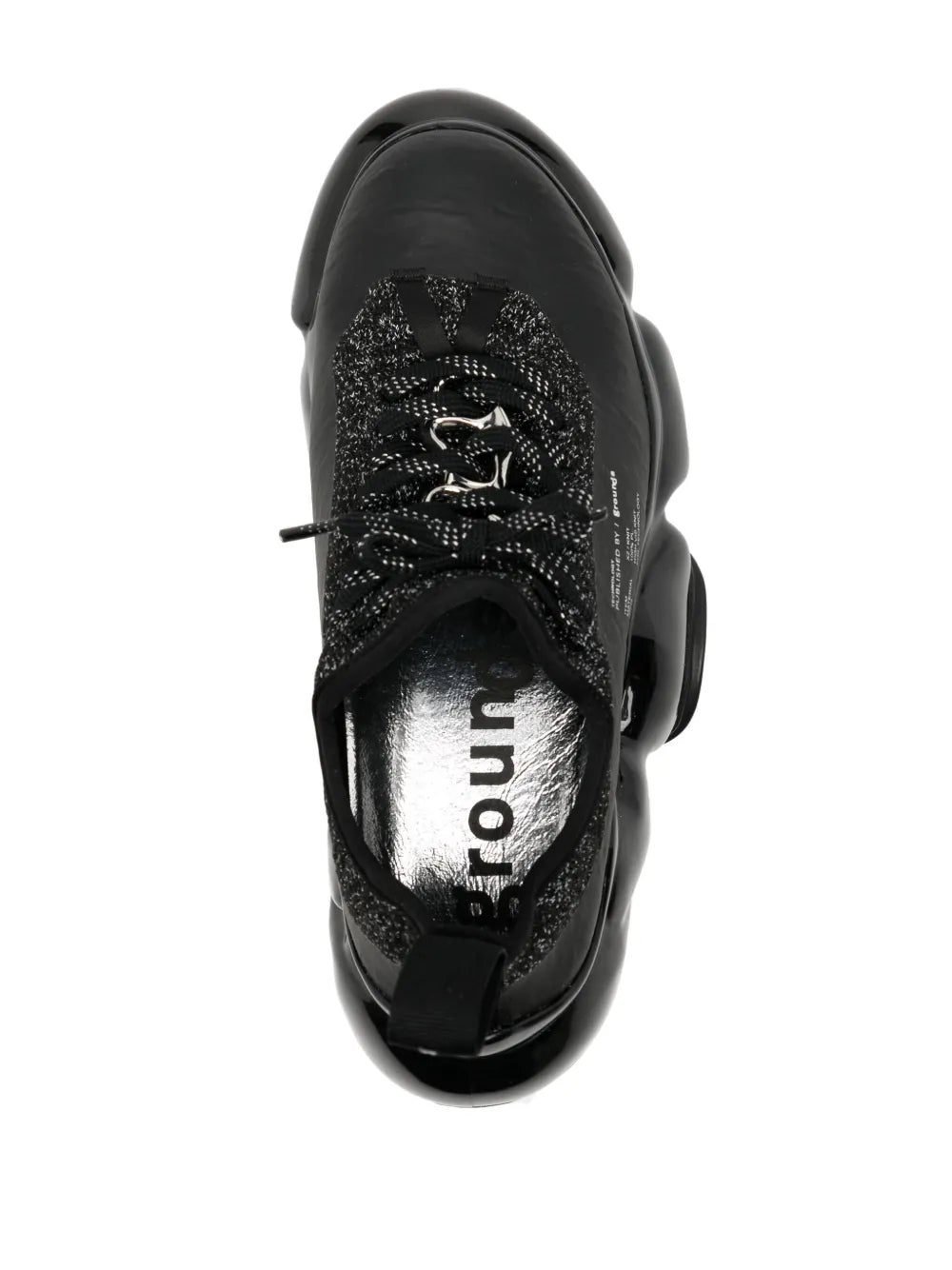 Black lace-up sneaker with glittery knit overlay and rounded glossy toe cap
