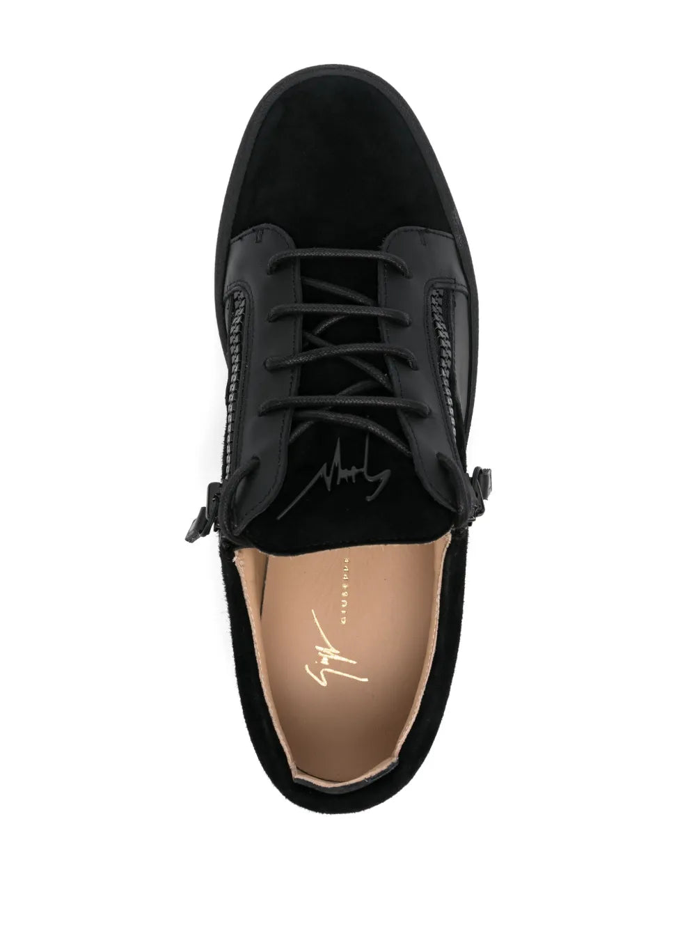 Black low-top sneakers with lace-up front, open top showing tan lining