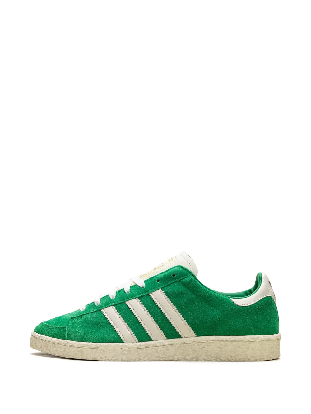Green suede adidas sneakers with white stripes, lace-up front and cream sole