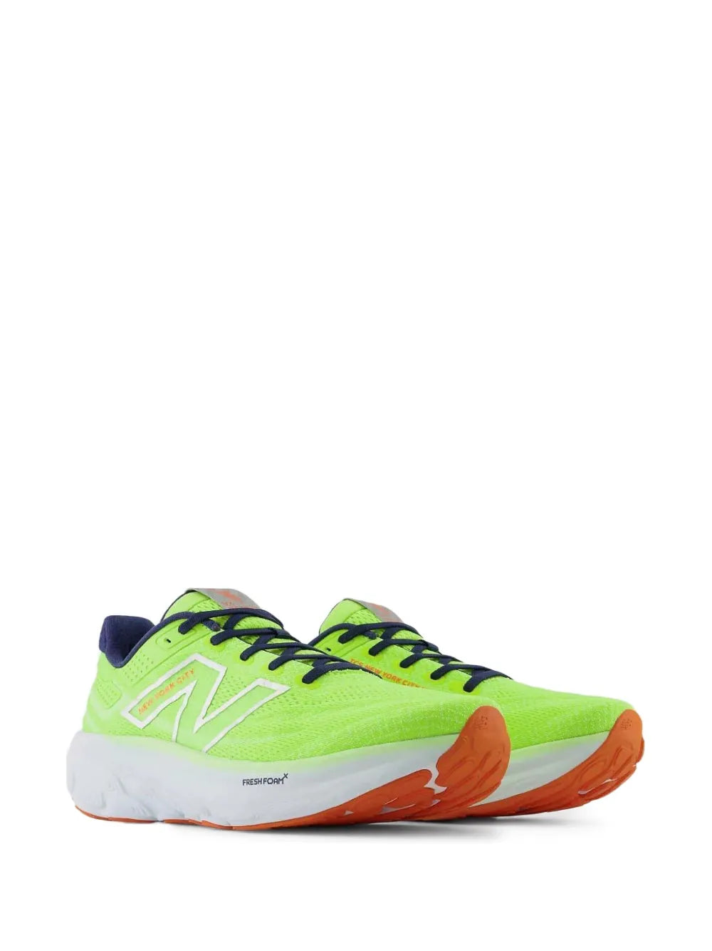 Neon green running shoes with navy collar, orange outsole and white midsole