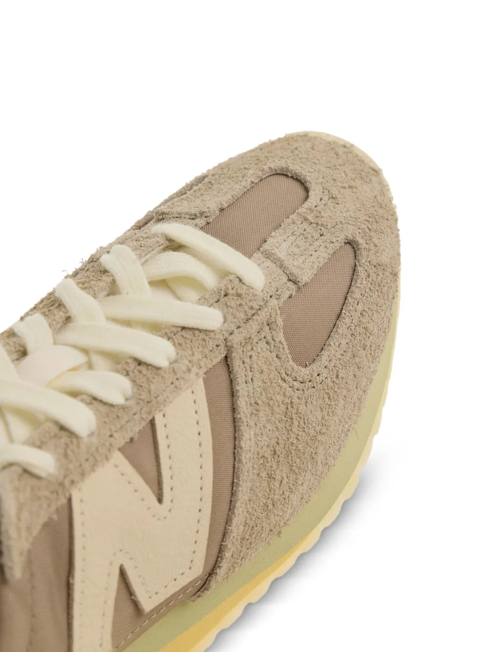 New Balance U471 suede side close-up with cream N logo and lace eyelets