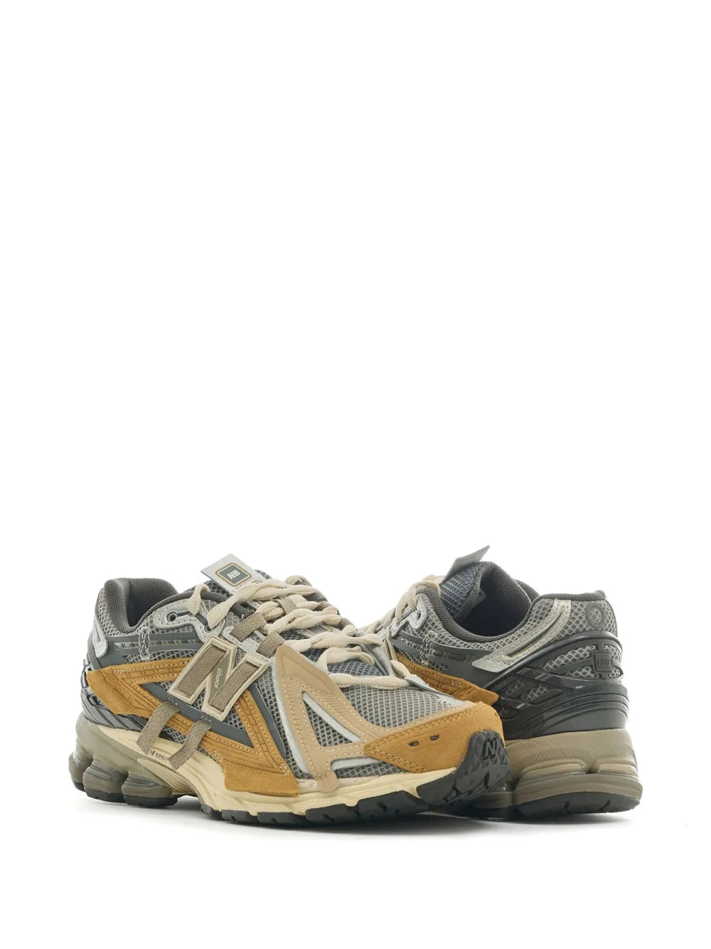 Pair of grey and tan lace-up sneakers with N logo and cushioned sole