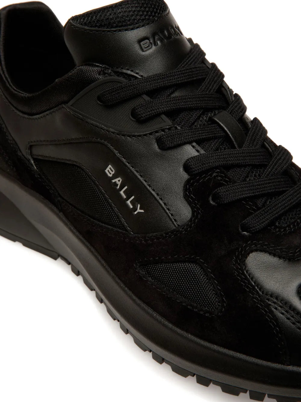 Black Bally sneakers close-up with lace-up front, side panels, and logo