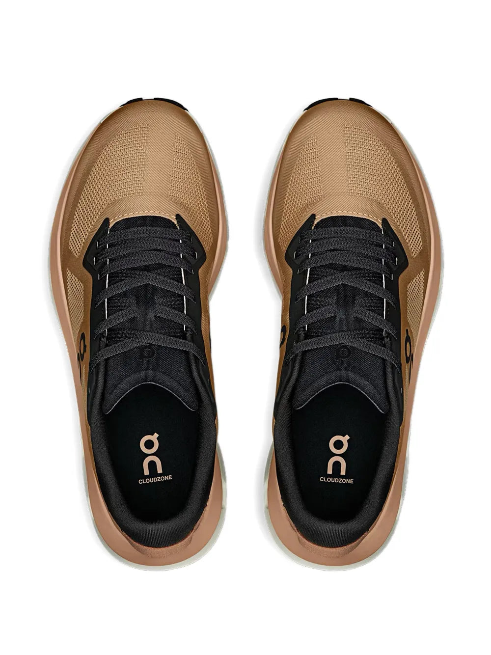 Pair of light brown running shoes with black tongue and lace-up front
