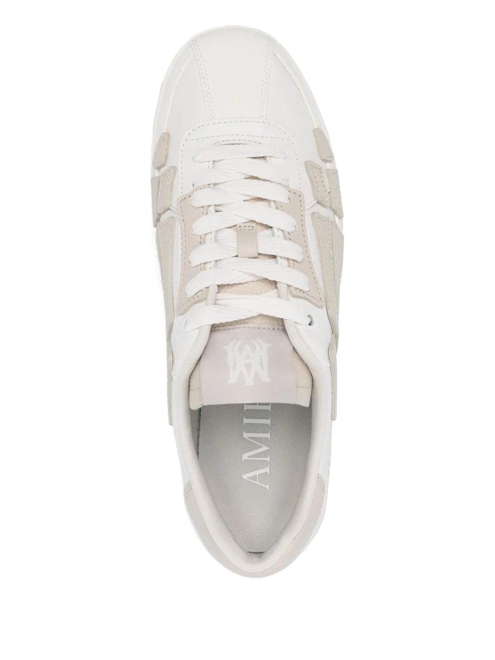 White low-top sneaker upper with lace eyelets and AMI logo on tongue lining
