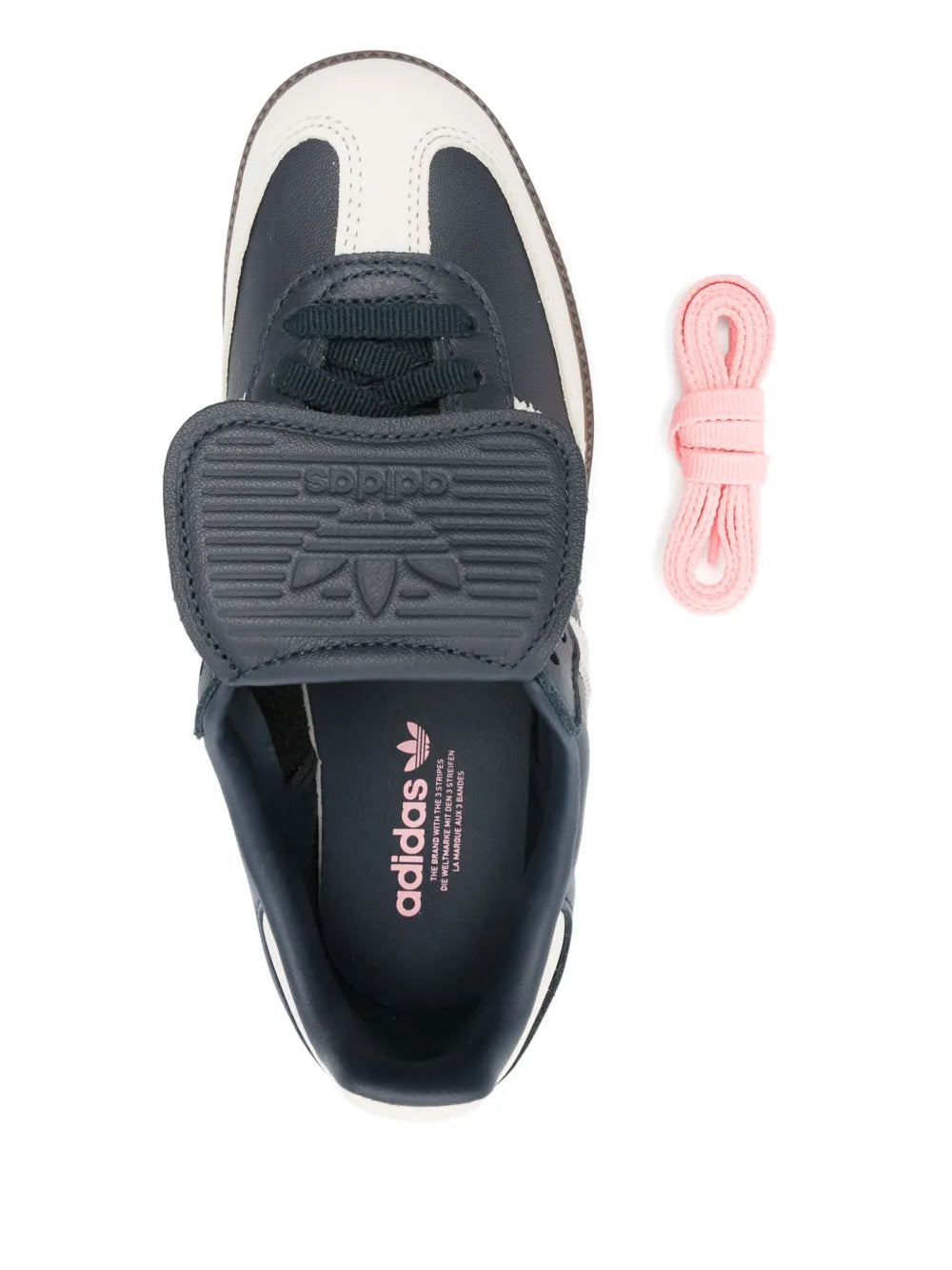 adidas Samba sneaker insole close-up, blue lining with adidas logo and laces