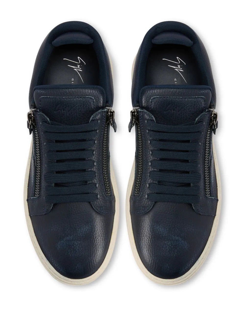 Navy leather low-top sneakers with lace-up and dual side zippers, beige sole