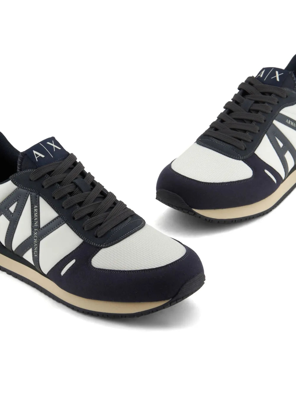 Navy and white logo-patch sneakers angled view with AXA side stripes
