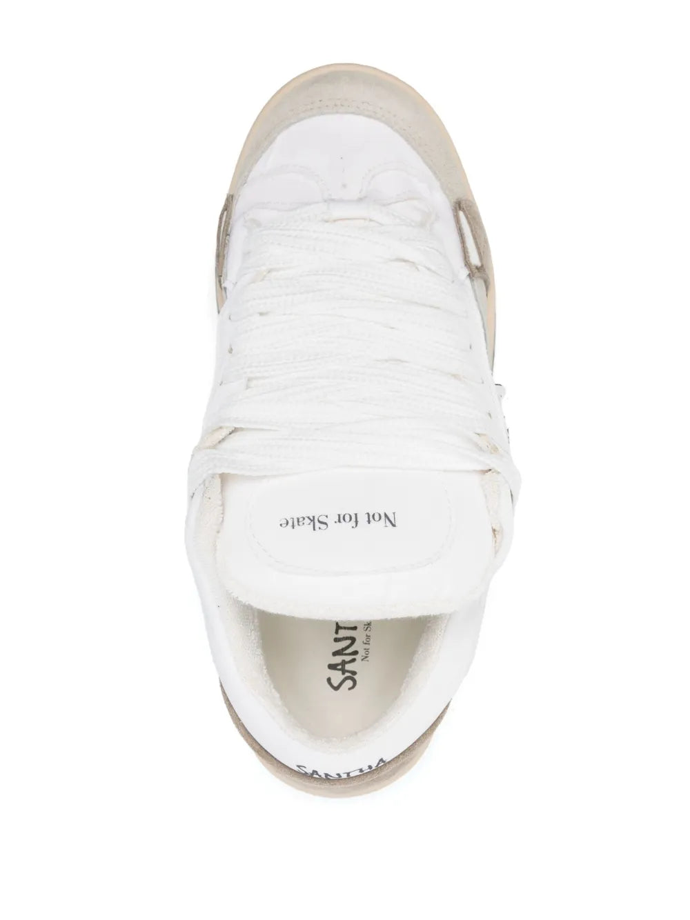 White lace-up sneakers with logo text on insole and padded collar