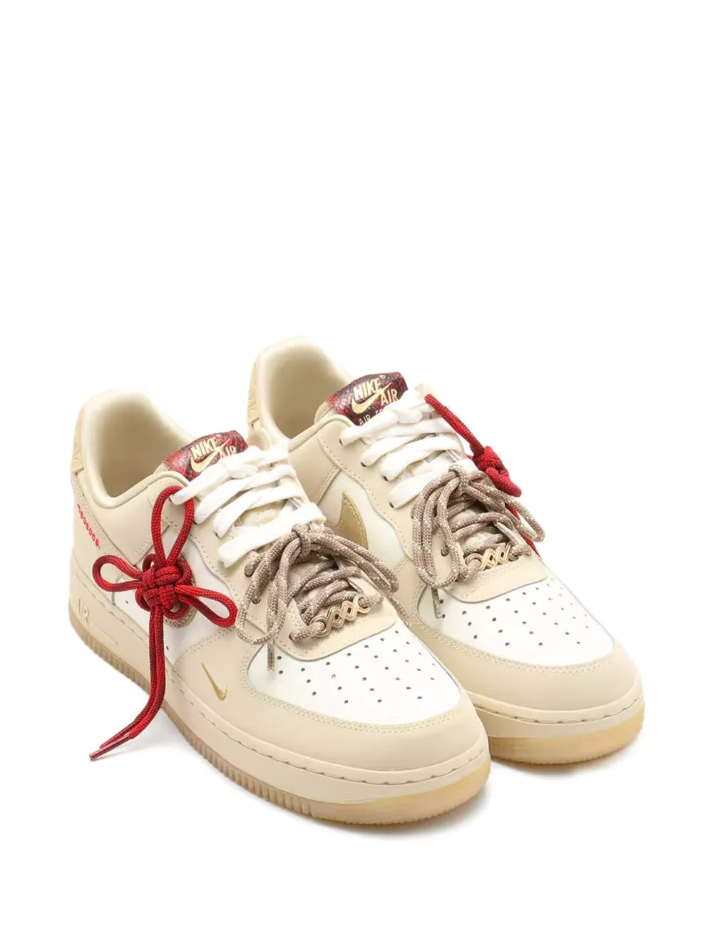 Pair of taupe Nike Air Force 1 '07 Lx sneakers with red lace-up detail
