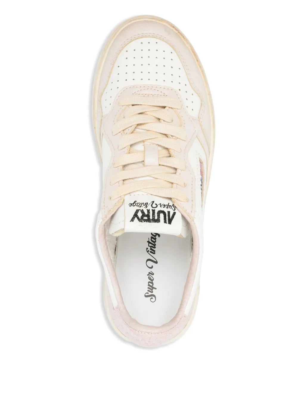 White low-top sneaker with laces and interior label; stitched toe cap, front view