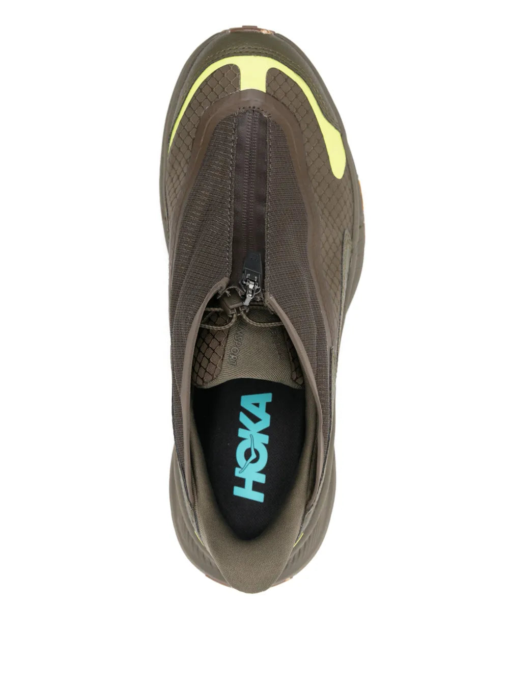 Khaki slip-on sneaker showing black Hoka logo on inner lining, neon heel trim
