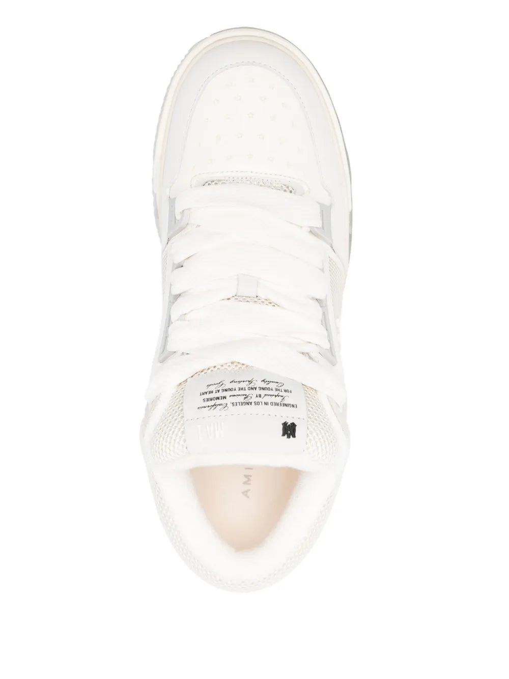 White lace-up sneaker with visible interior label at the tongue opening