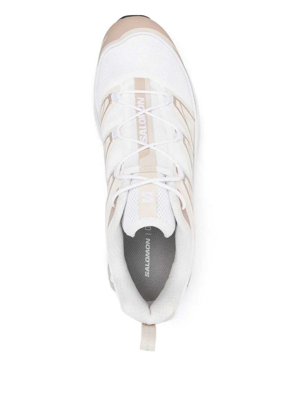 White running shoe top view, lace-up with padded tongue, beige heel panel, black sole