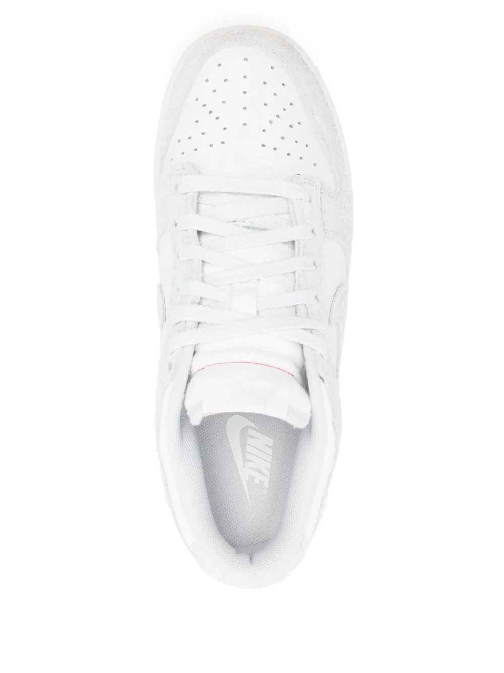White Nike Dunk Low low-top sneakers, top view of laces and perforated toe