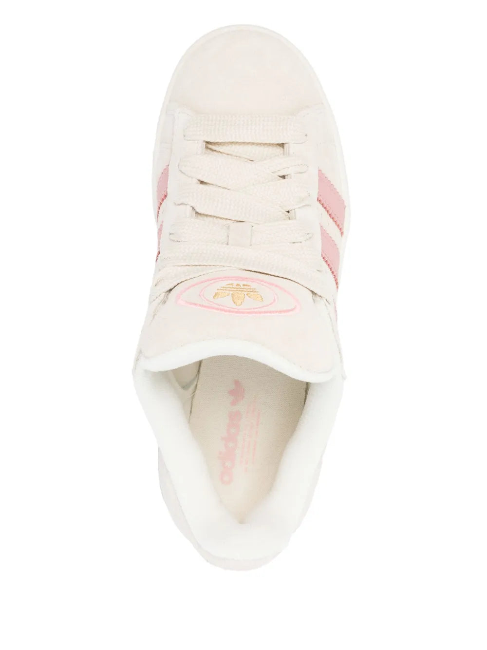White low-top sneaker with lace-up closure and pink logo patch on tongue