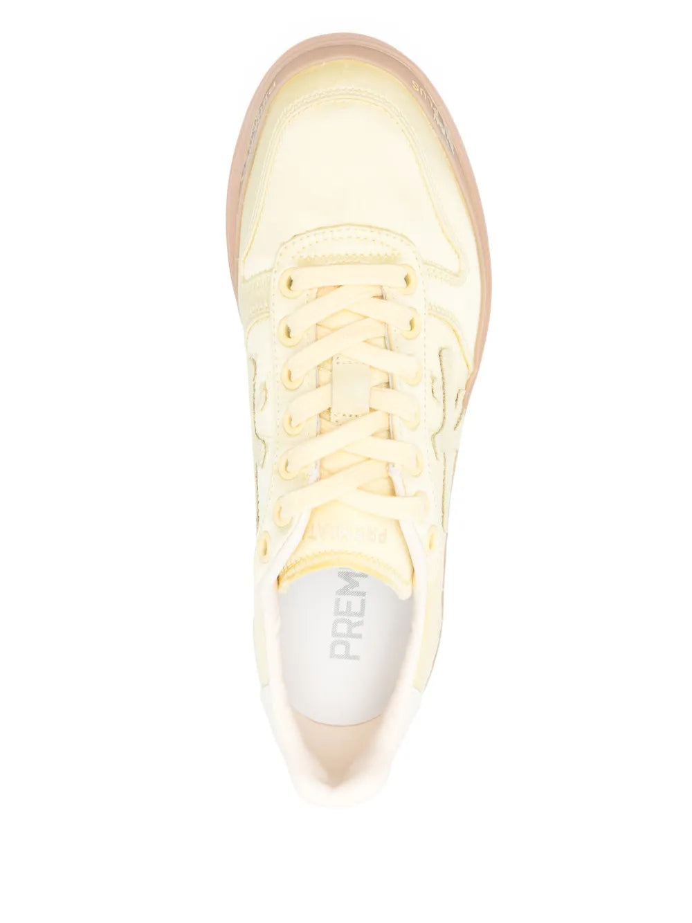 Pale yellow lace-up sneakers, top view with embroidered tongue logo and white laces
