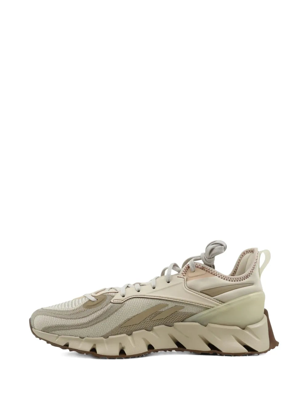 Beige running sneakers side profile with layered midsole and lace eyelets