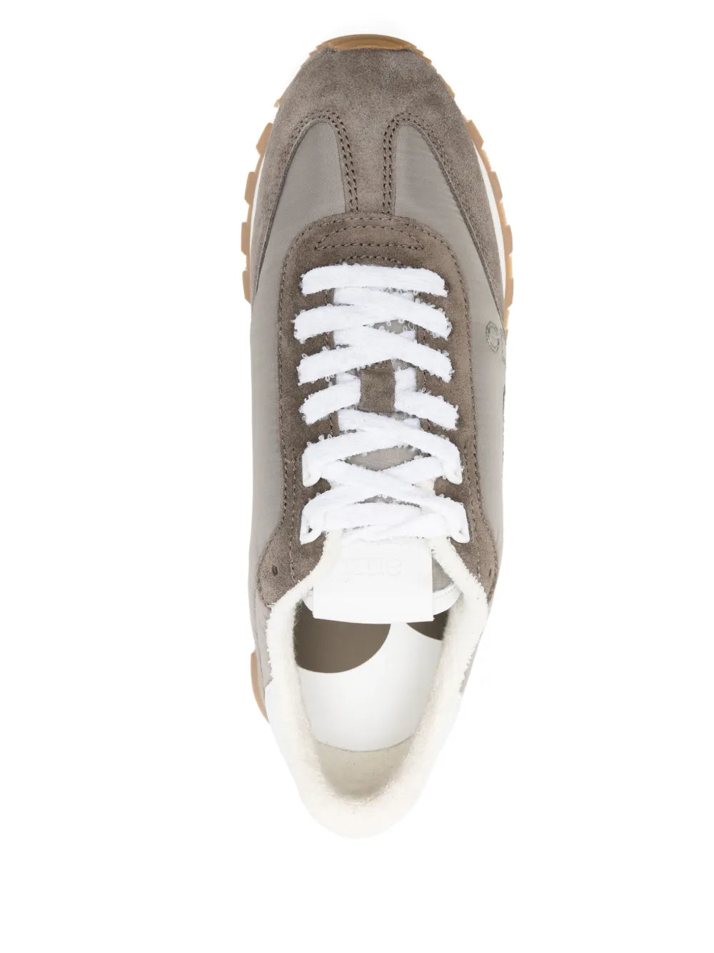 Front view of ash grey and off-white sneaker with white lace-up and padded tongue