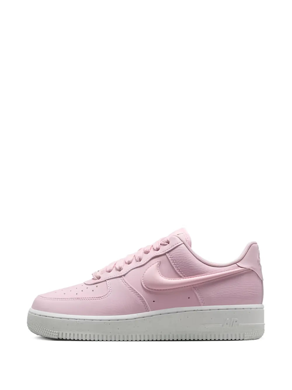 Pink low-top sneakers with Swoosh overlay, lace eyelets, and cushioned tongue