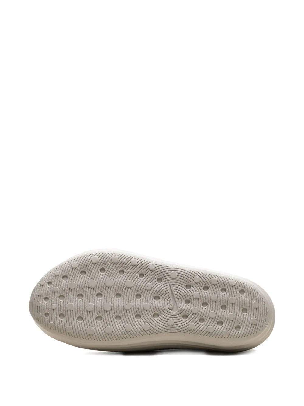 Nike slip-on running shoe outsole, textured tread pattern on beige rubber base
