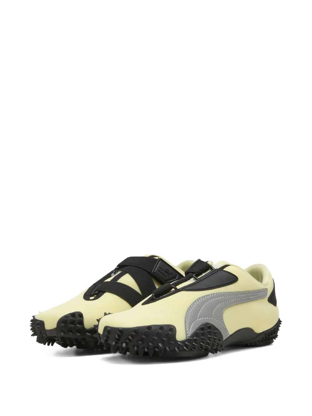 PUMA Mostro Og lace-up sneaker, cream yellow with black accents and rubber tread sole.