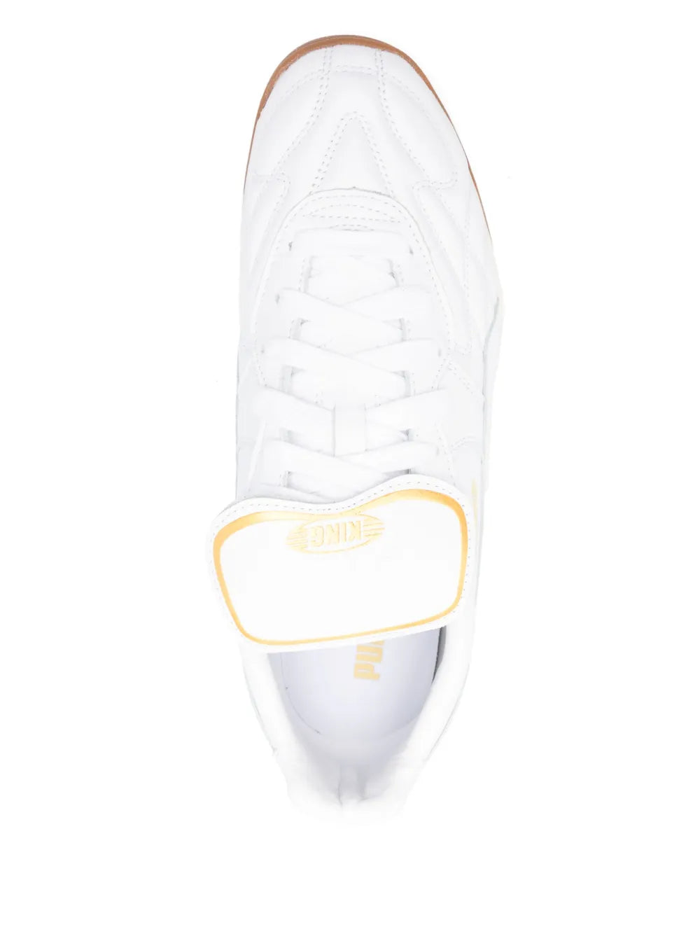 White PUMA King indoor shoe close-up of laces and gold-trimmed heel tab