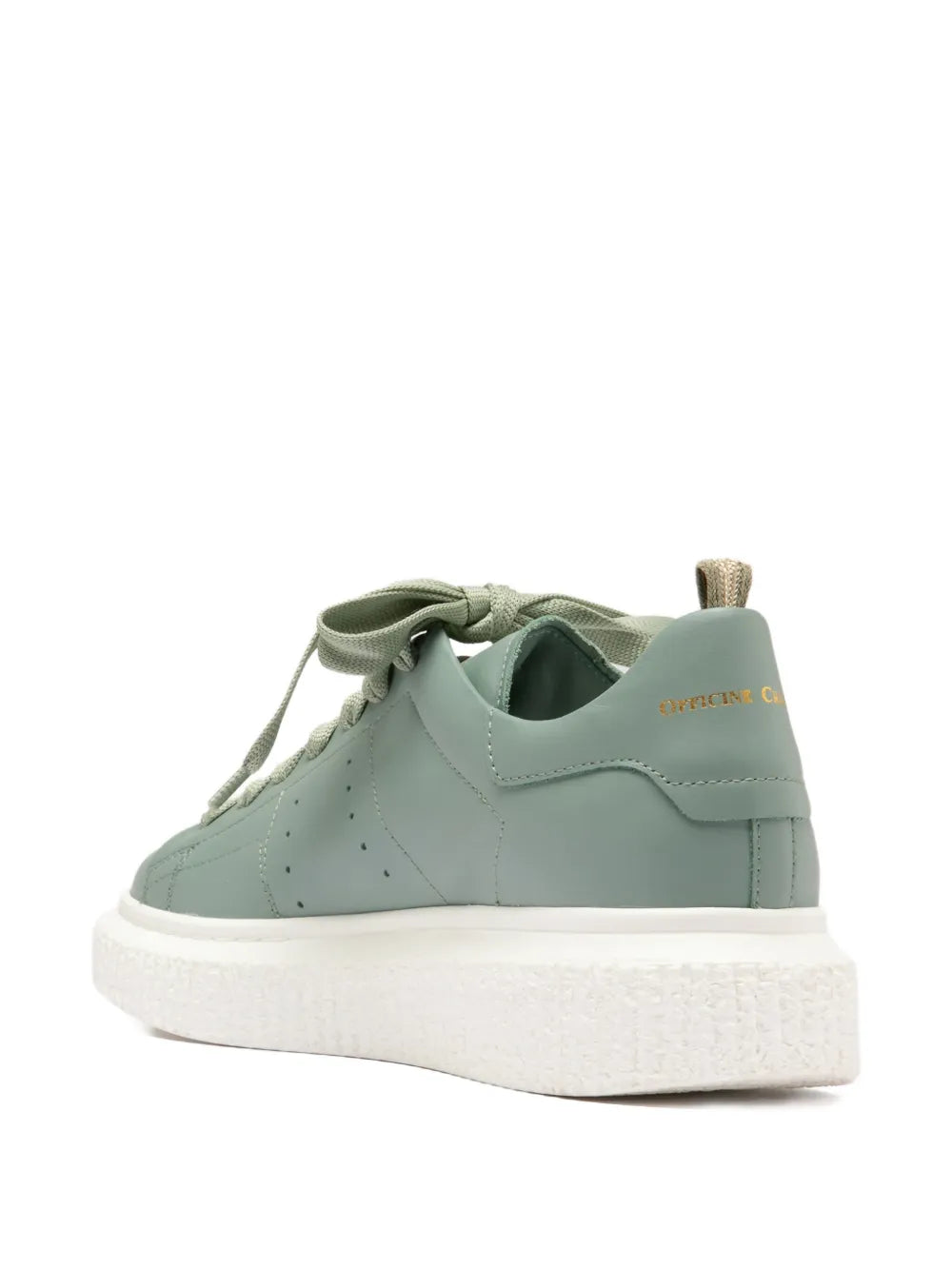Green lace-up platform sneaker side profile with padded tongue and white rubber sole