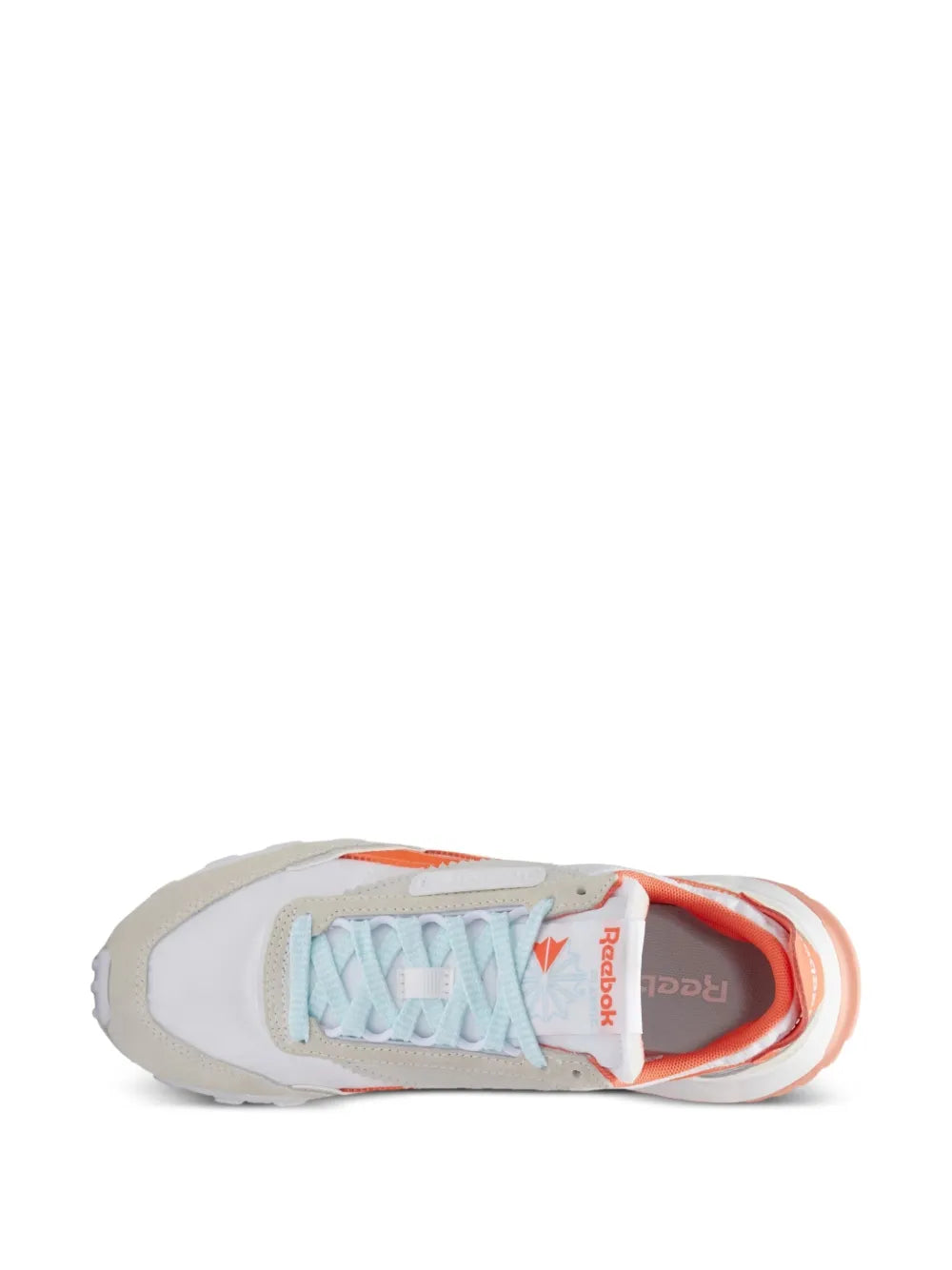 Low-top sneakers, outsole and interior view with orange lining and Reebok logo