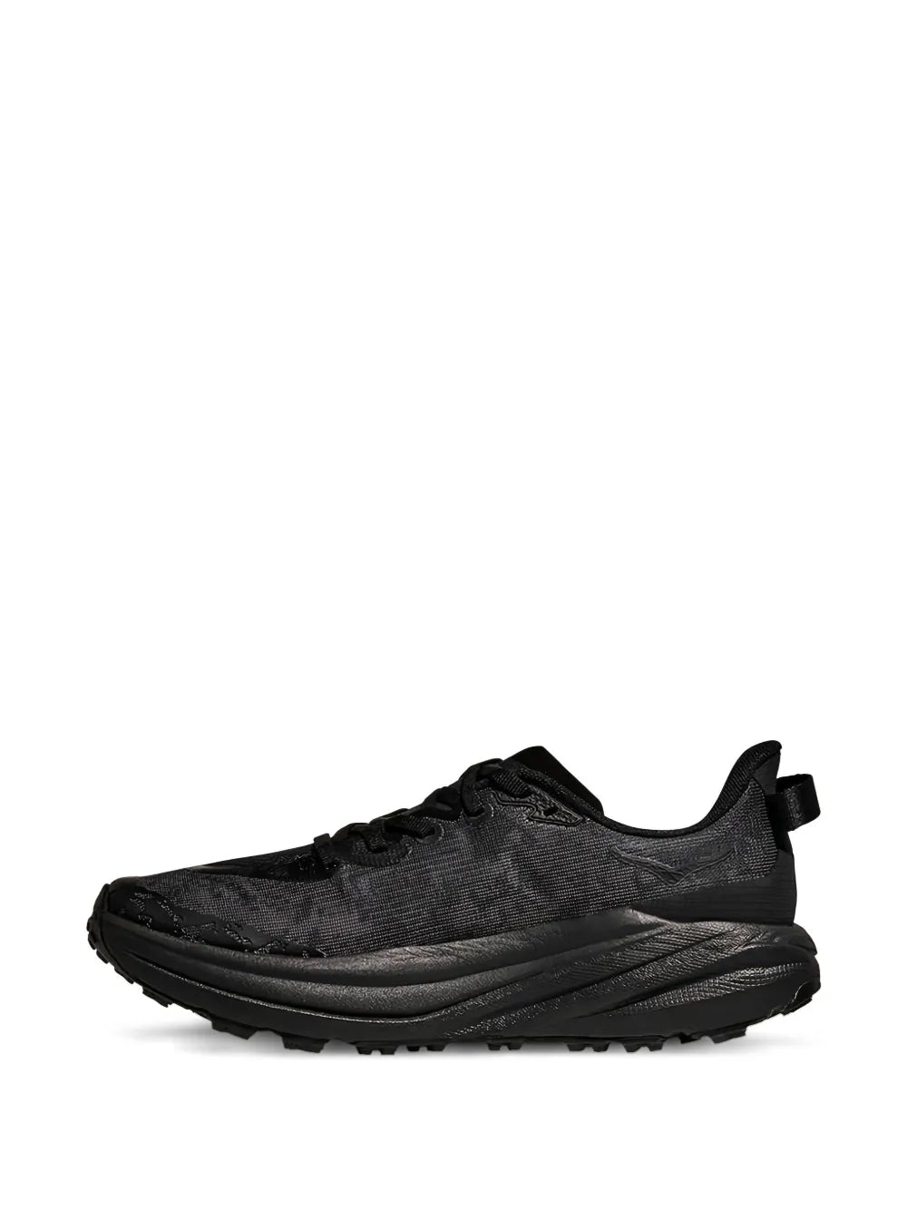Black lace-up trail sneaker side view with textured upper and traction lug outsole
