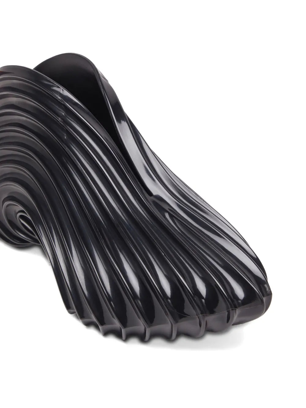 Black glossy molded sneaker with ribbed swirl texture and curved side