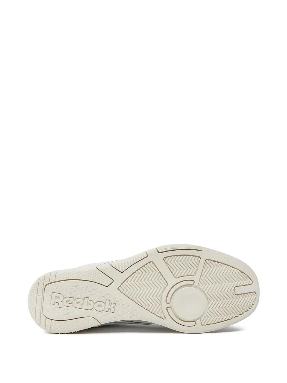 Reebok white sneaker outsole, textured rubber tread with brand mark