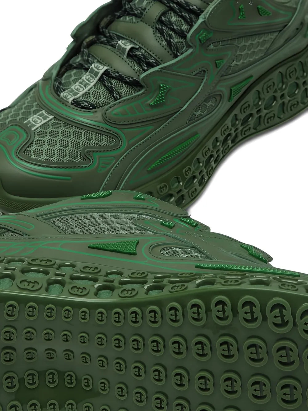Dark green Gucci Cub3D sneakers close-up, embossed details on mesh and rubber outsole.