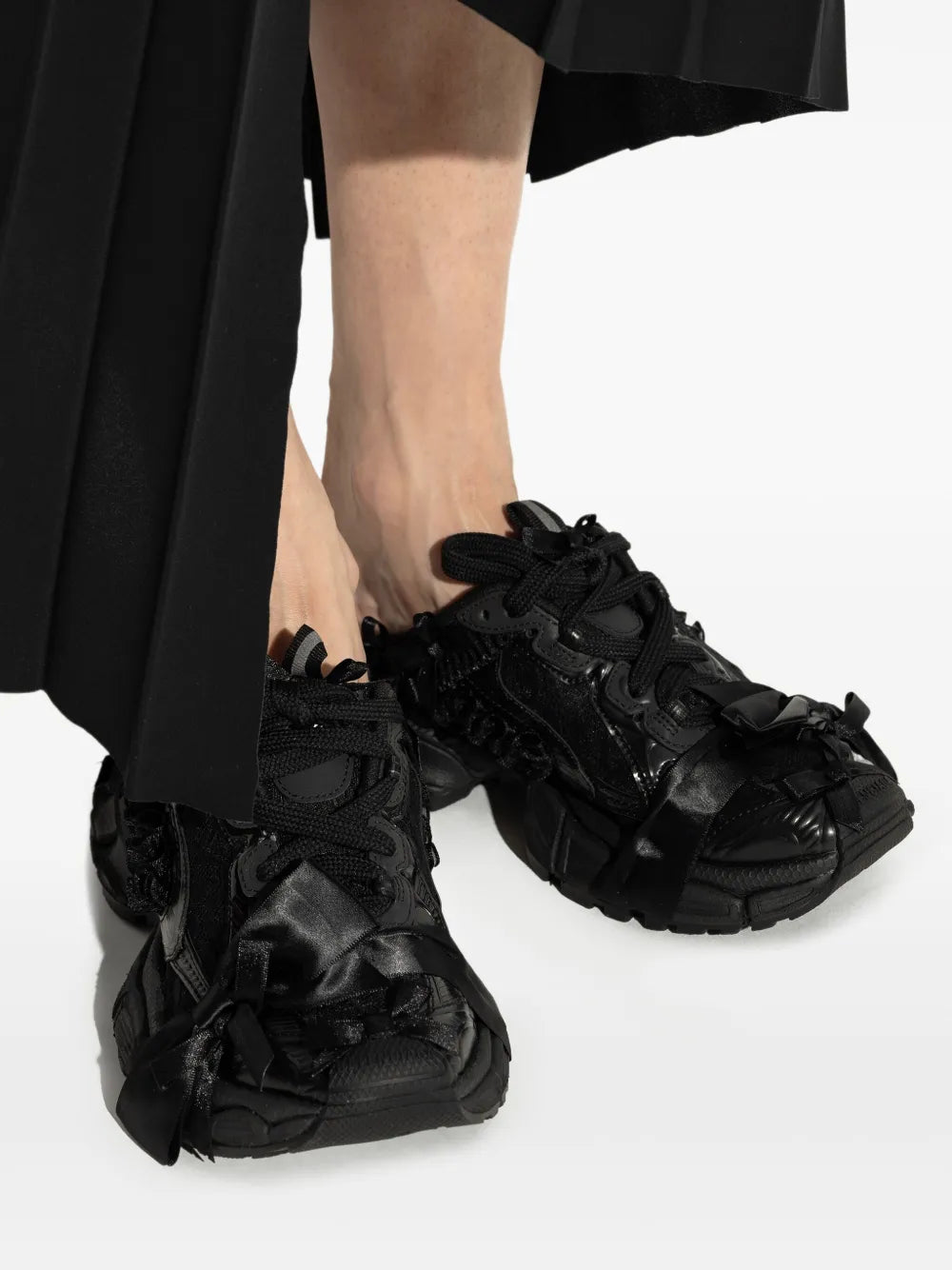 Balenciaga Wxlmc 1000 black lace-up sneakers close-up on feet, chunky tread