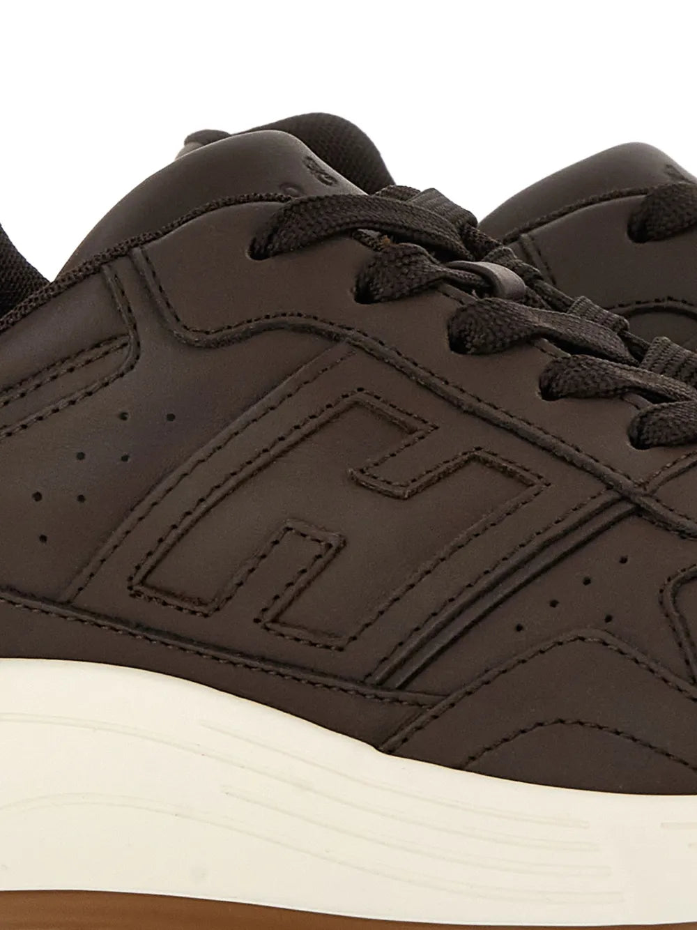 Hogan Hyperlight sneakers close-up: chocolate brown leather with perforations and stitching