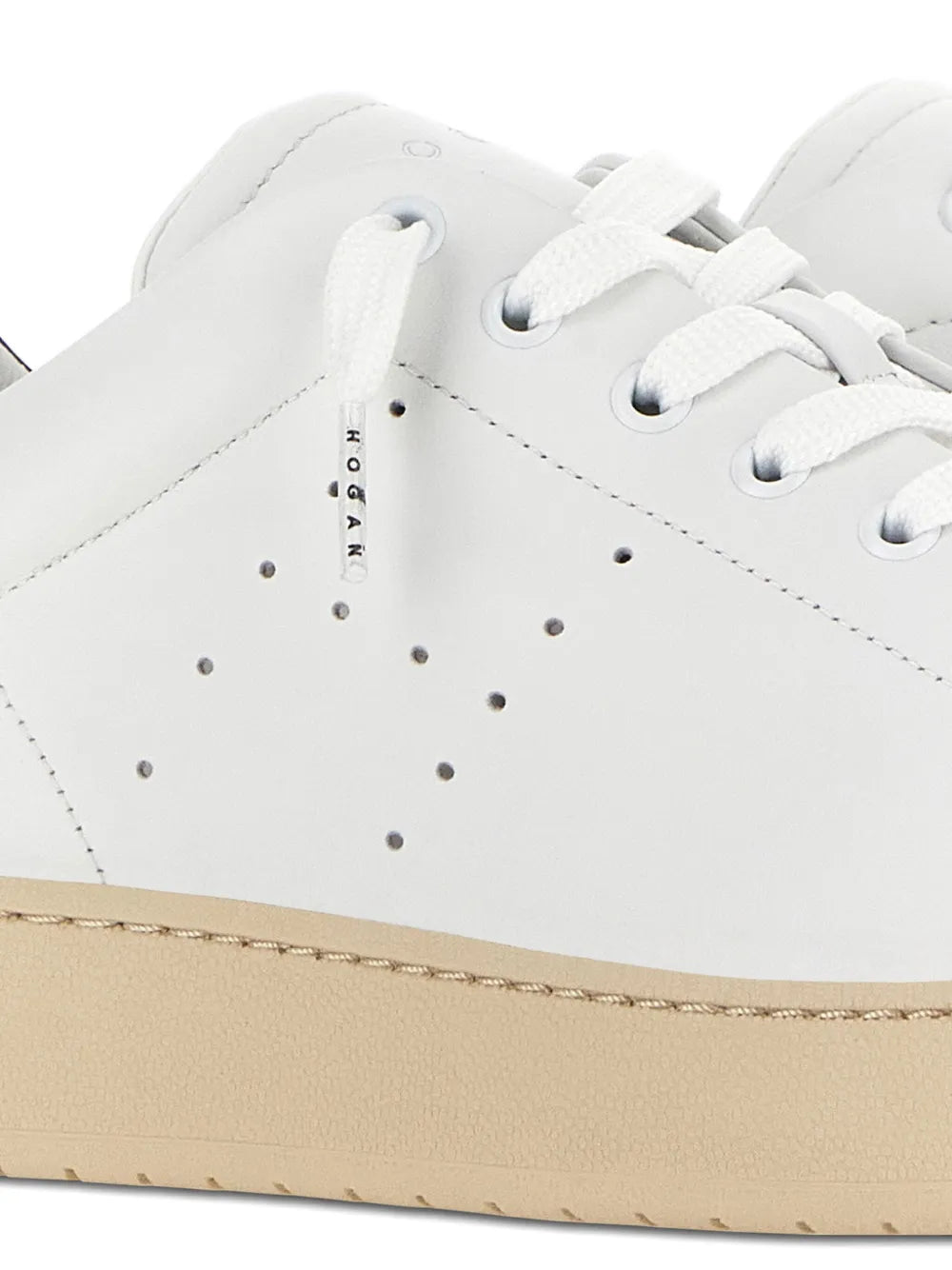 Hogan H672 sneakers close-up, white perforated toe and stitched panels with laces