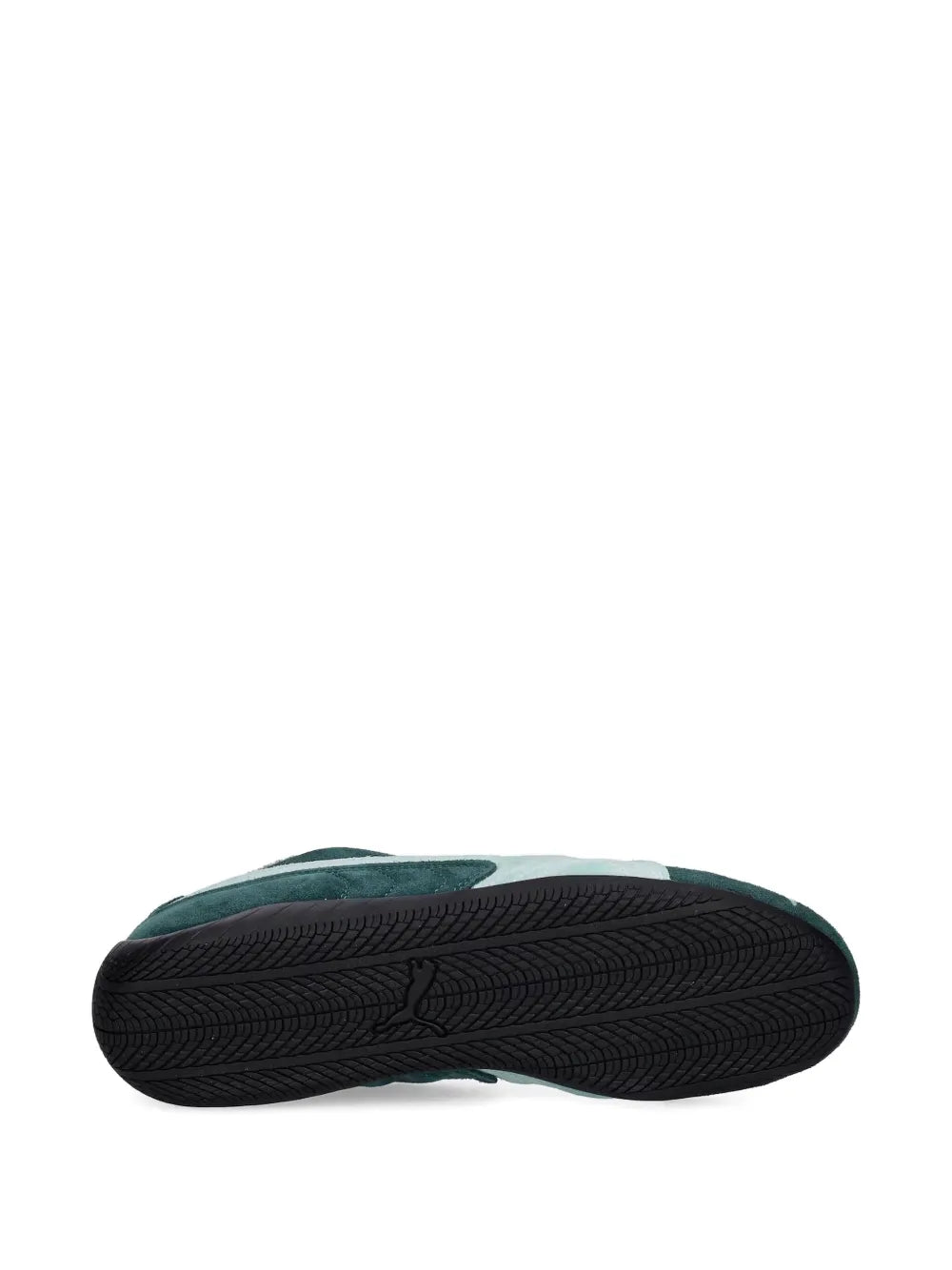 Speedcat sneaker outsole in black with textured tread pattern