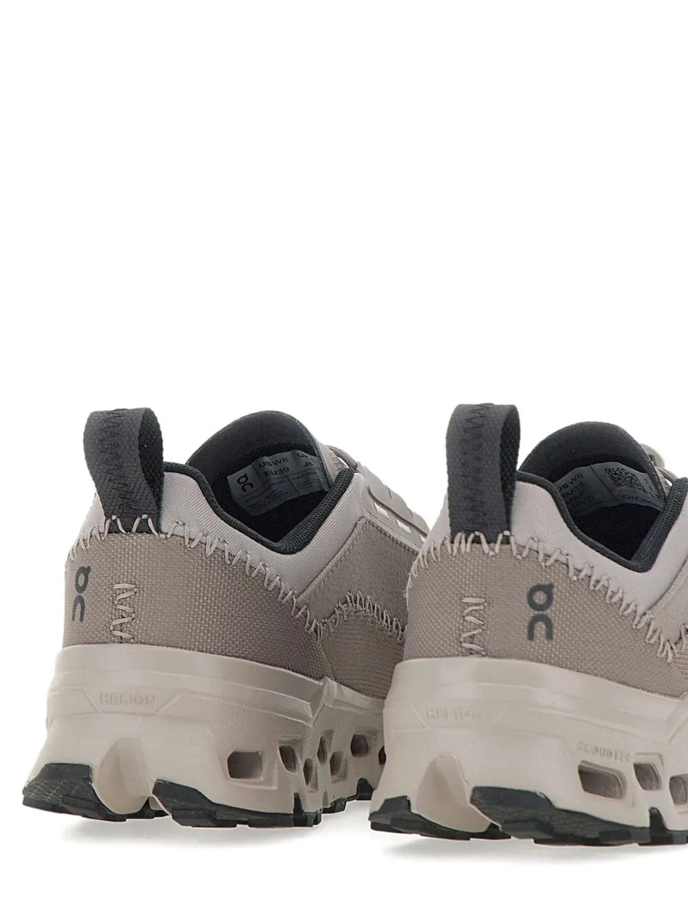 Grey lace-up running shoes back view with cloud pod outsole and heel loops