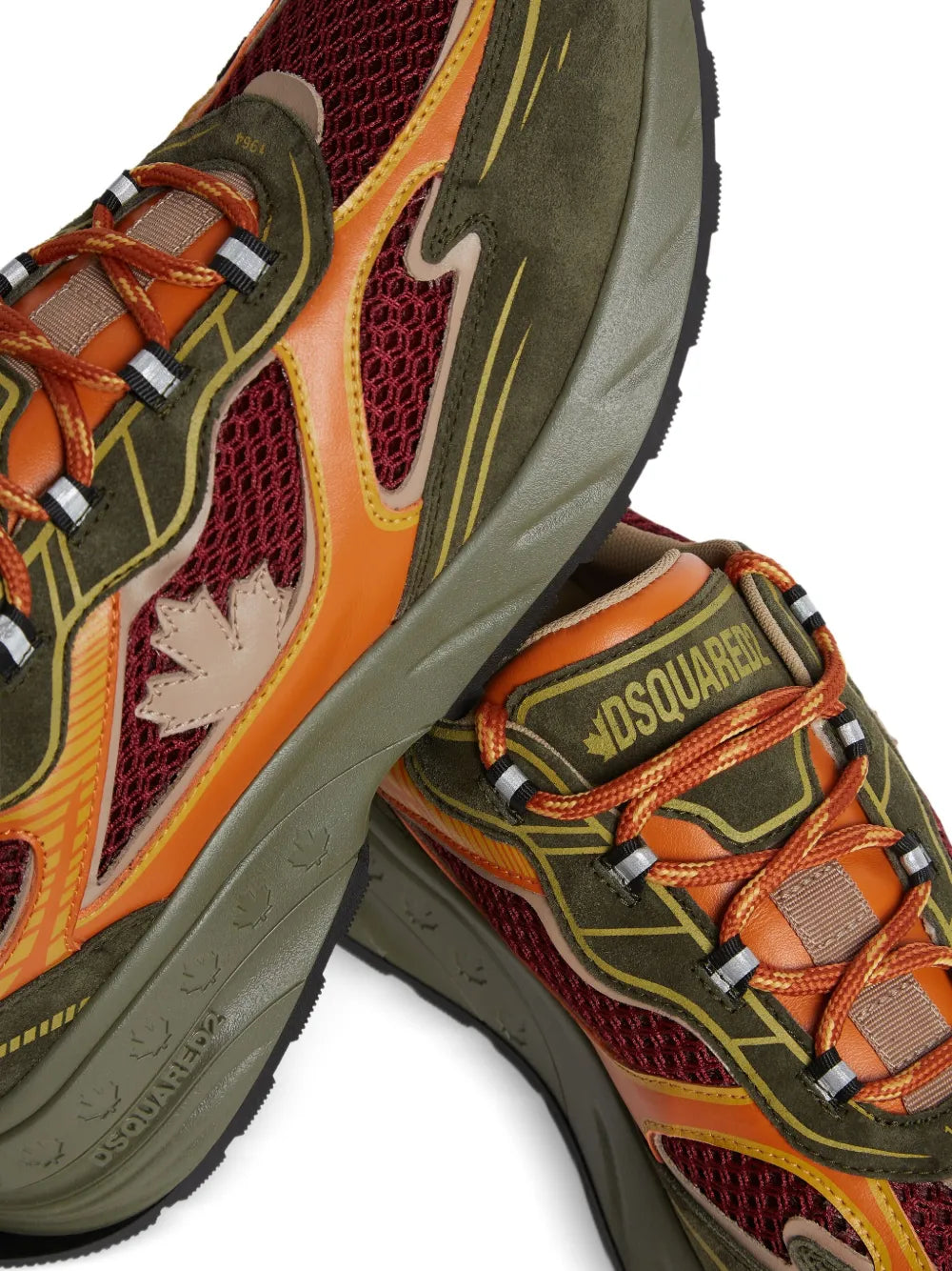 Suede sneaker close-up with lace-up, DSQUARED2 logo patch, and multicolor panels