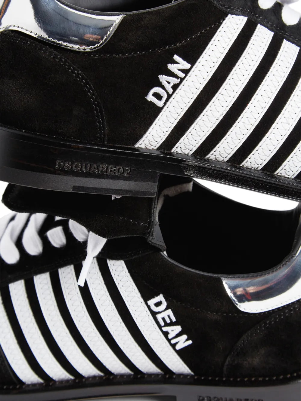 Dsquared2 Boxer sneakers close-up, black sole with 'DSQUARED2' and white triple stripes