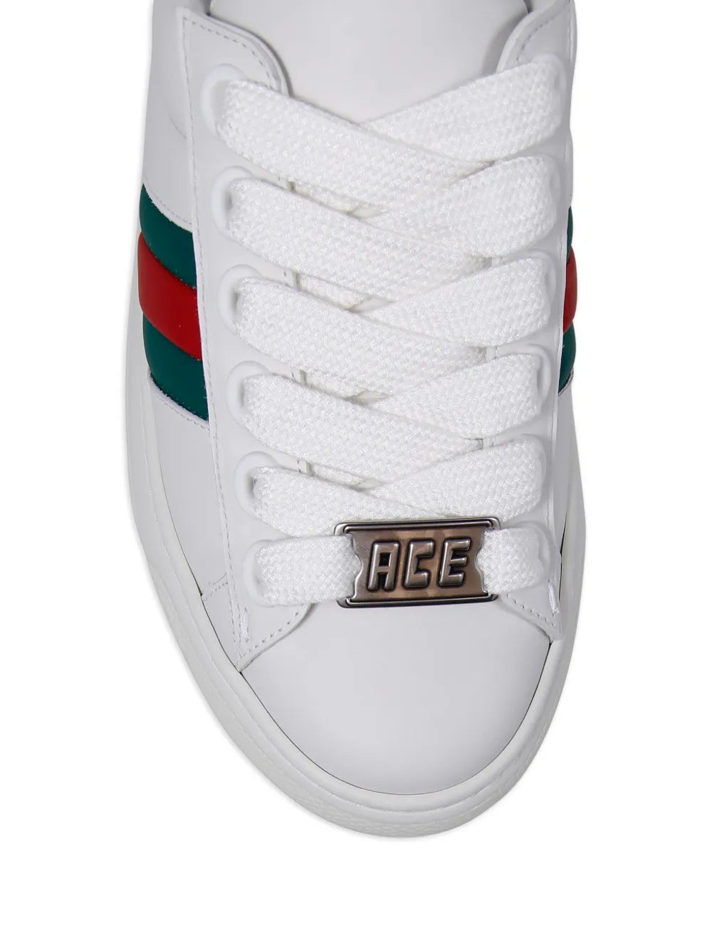 White Gucci leather sneaker tongue with 'ACE' metal buckle and lace-up front