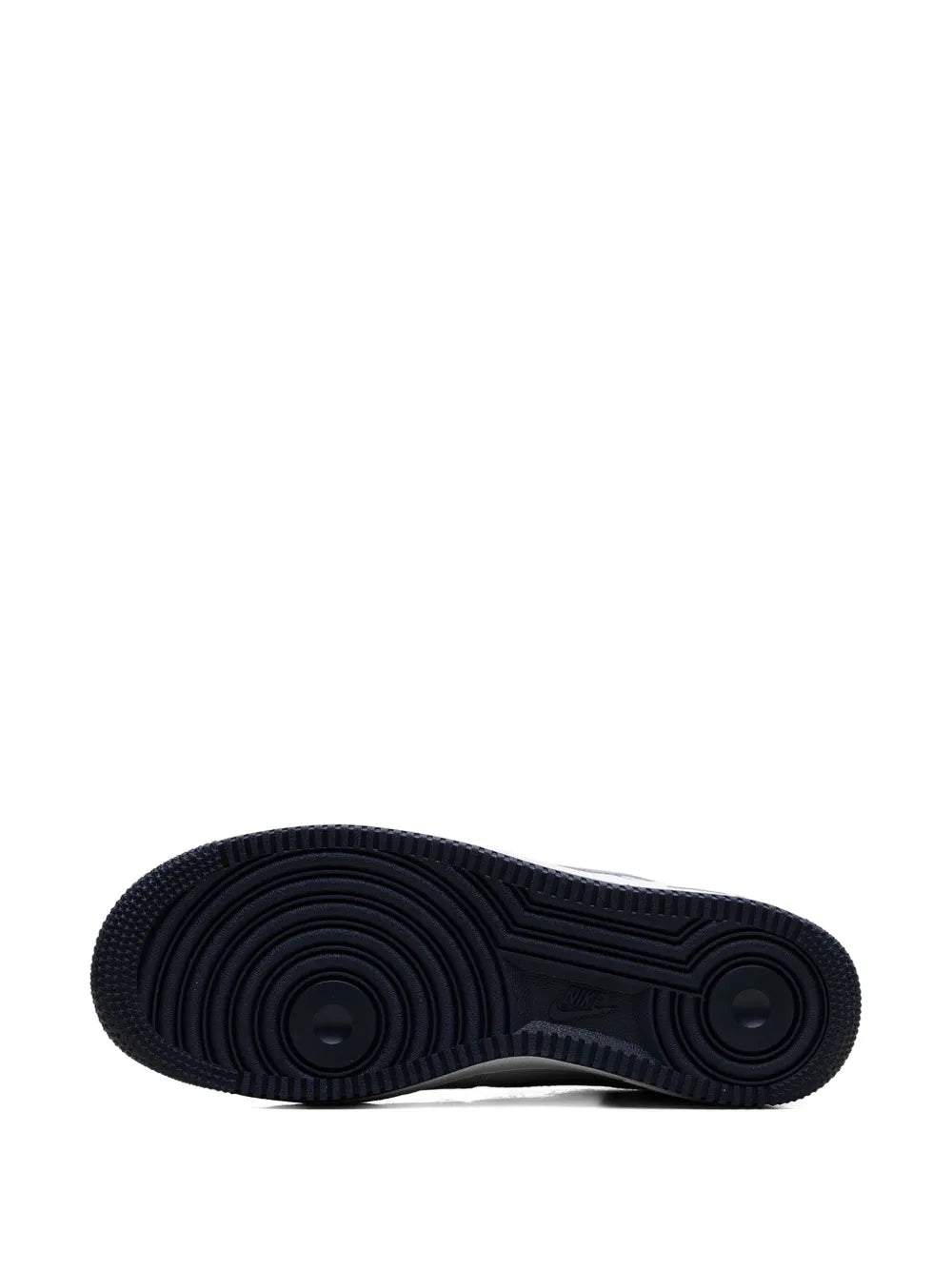 Navy/black rubber outsole with circular tread pattern and traction grooves