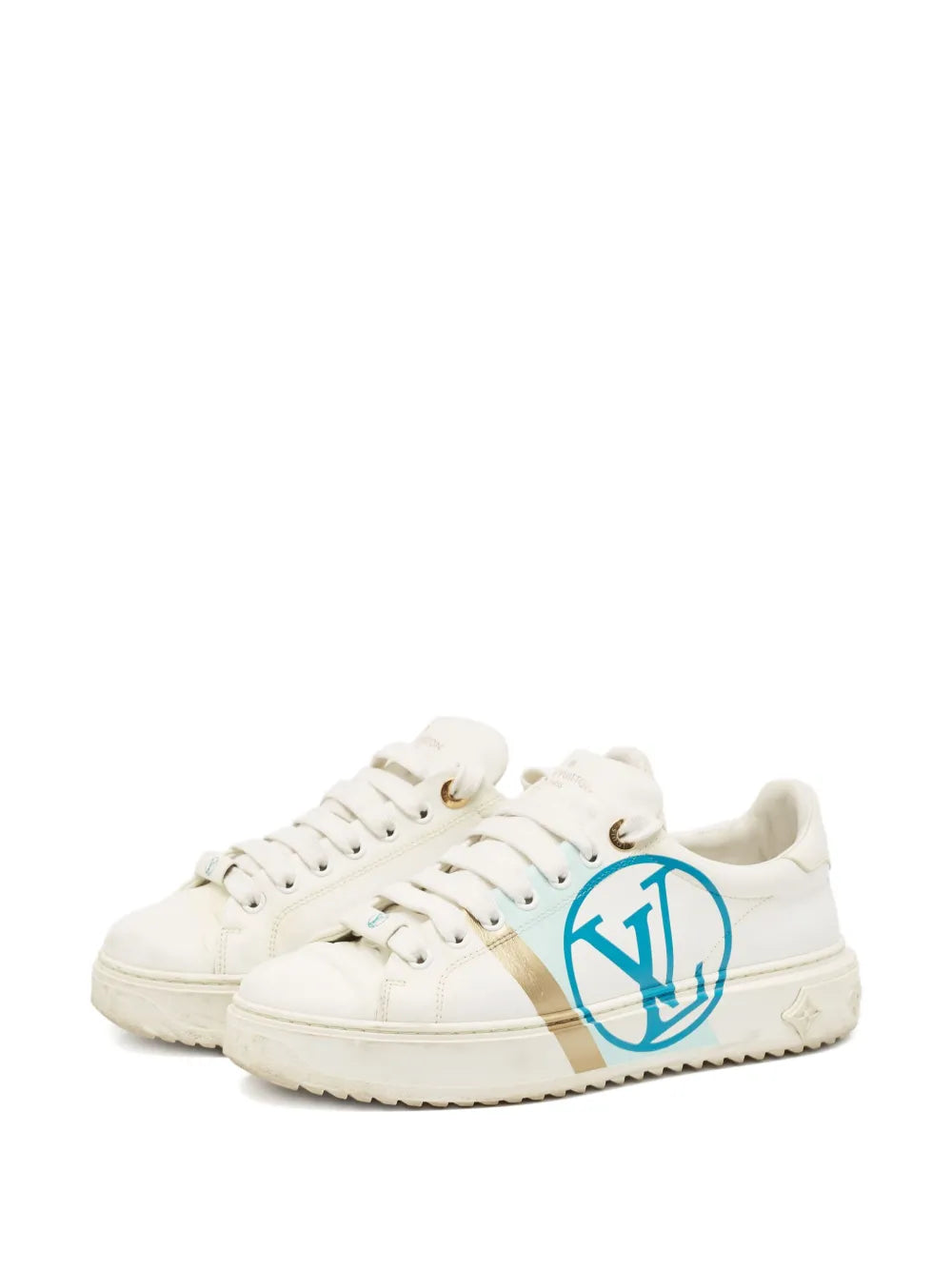 White leather low-top sneakers with tan side stripe and blue monogram emblem