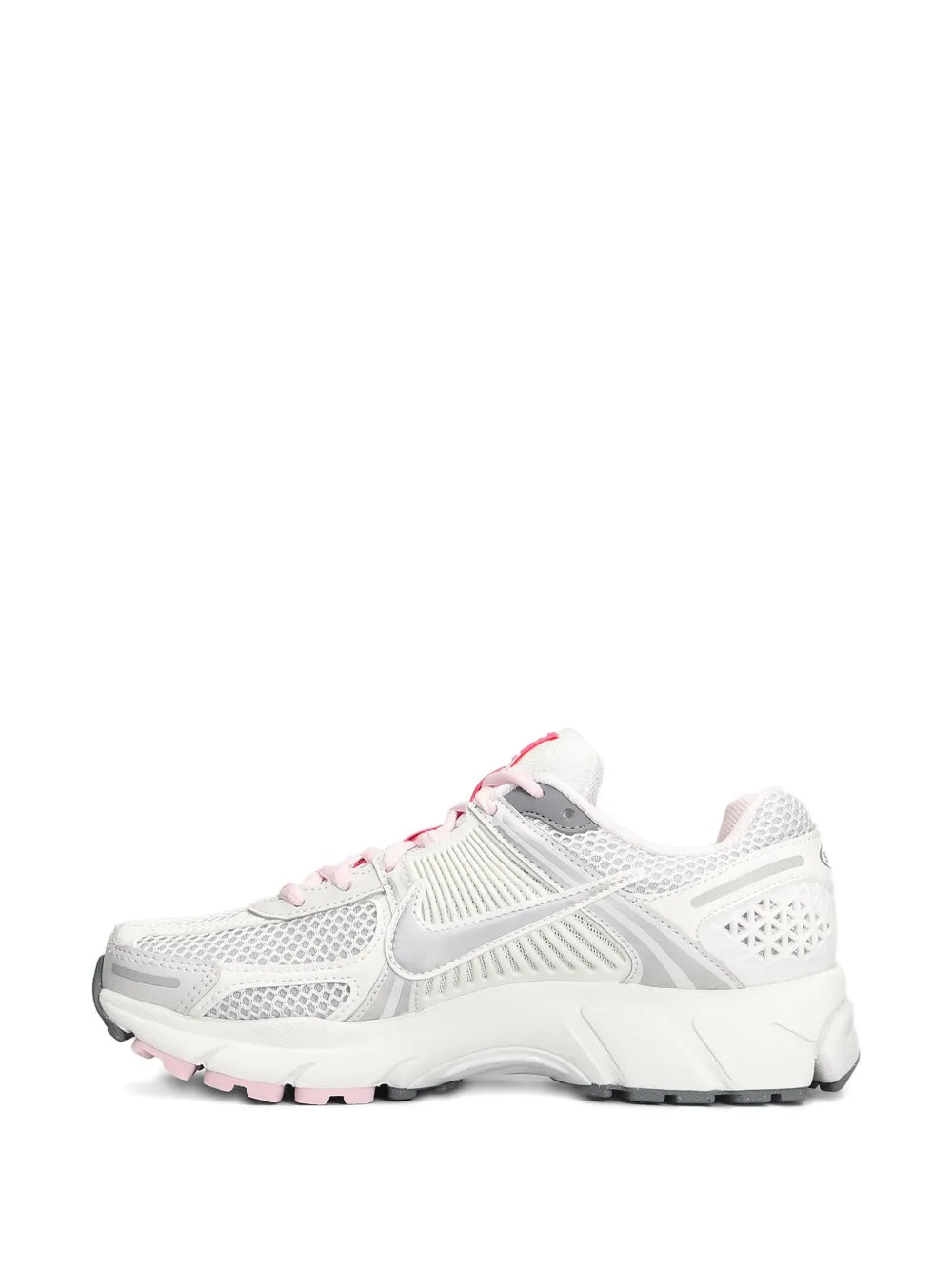 Nike white running shoes side view with pink lace trim and grippy rubber sole