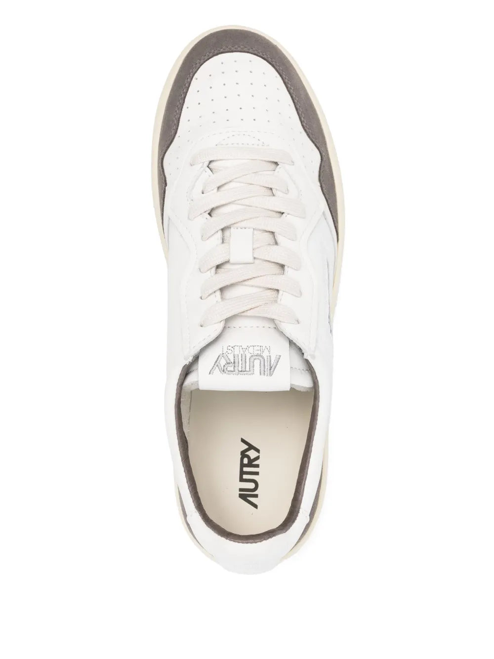 White sneaker with Autry logo on beige tongue lining and gray collar trim
