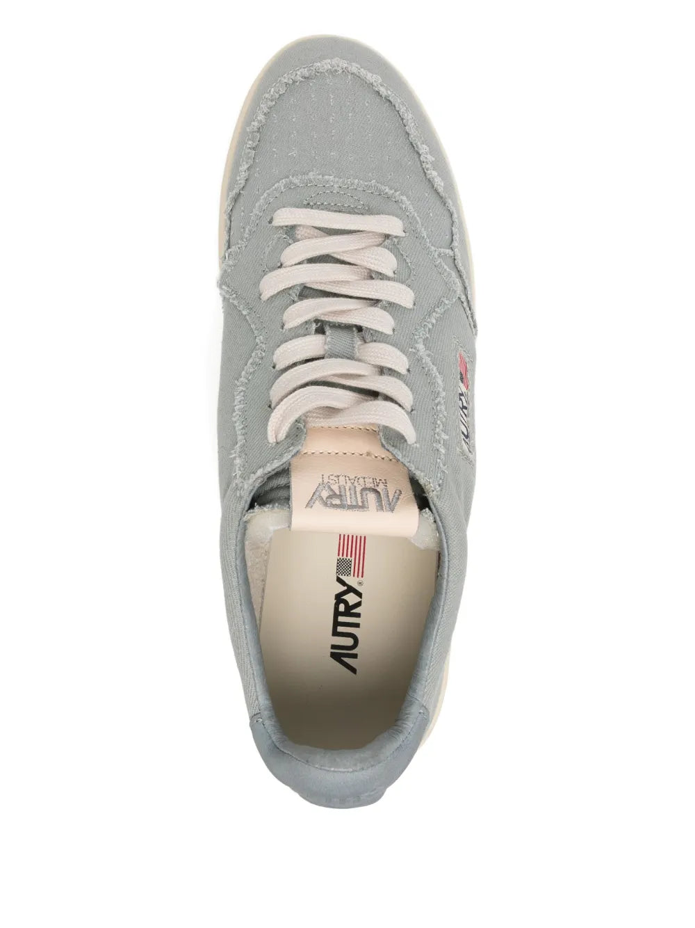 Light blue lace-up trainer with cream sole and tongue label showing Autry logo